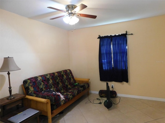 living room featuring ceiling fan and light tile patterned flooring