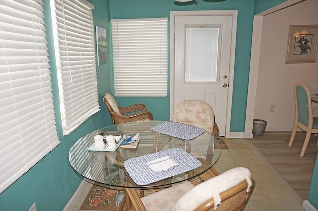 dining area featuring baseboards and wood finished floors