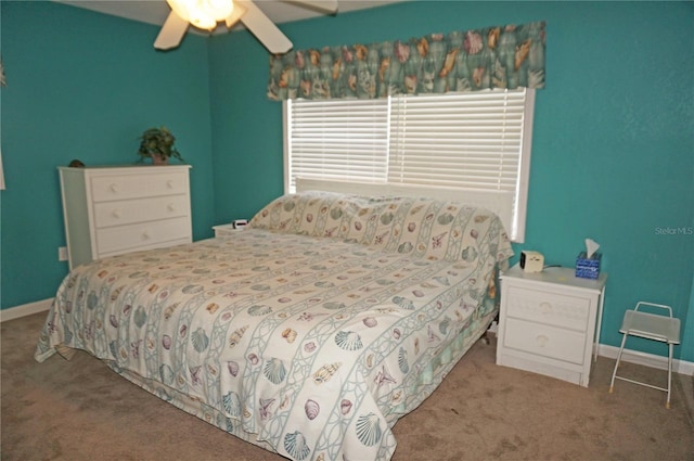 bedroom featuring ceiling fan and carpet