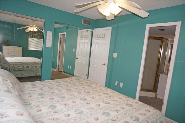 carpeted bedroom featuring ceiling fan and multiple closets