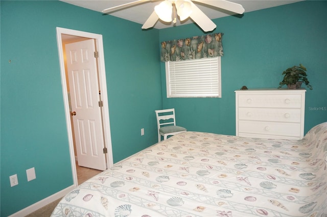 bedroom featuring ceiling fan and light carpet