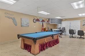 rec room featuring a drop ceiling, pool table, and light tile patterned floors