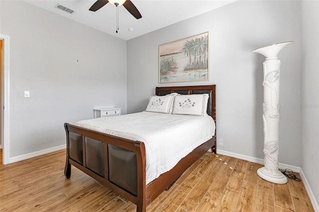 bedroom with ceiling fan and light wood-type flooring