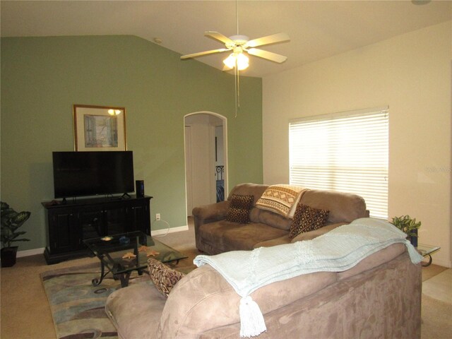 living room with ceiling fan, light carpet, and vaulted ceiling