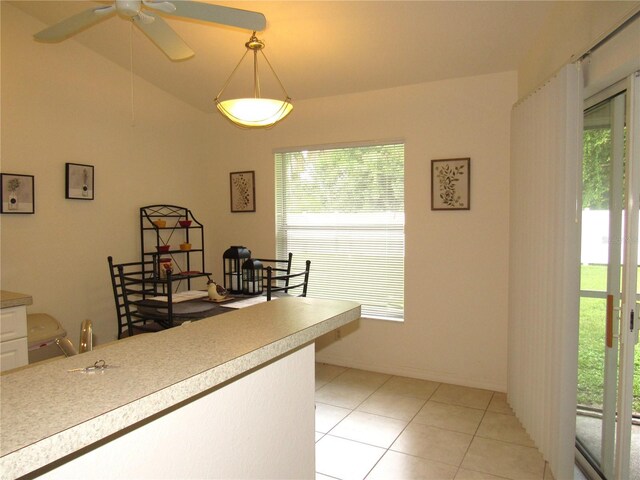 tiled office featuring ceiling fan