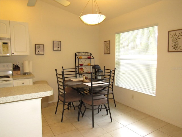 dining room featuring ceiling fan and light tile patterned floors