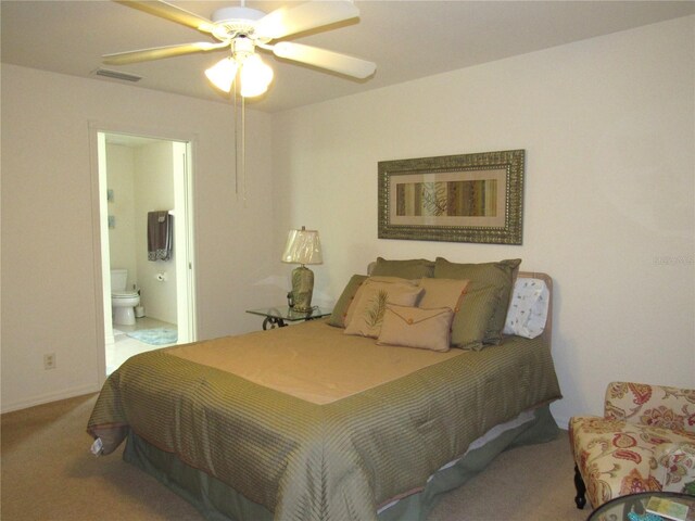 carpeted bedroom featuring ceiling fan and connected bathroom