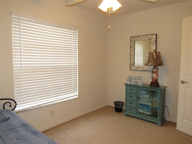 carpeted bedroom featuring ceiling fan