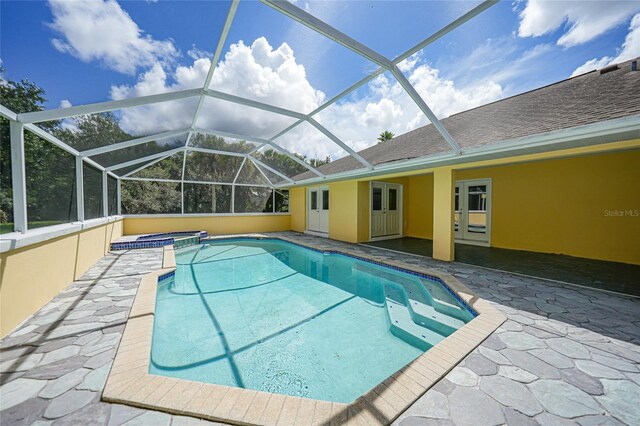 view of pool featuring a patio and a lanai