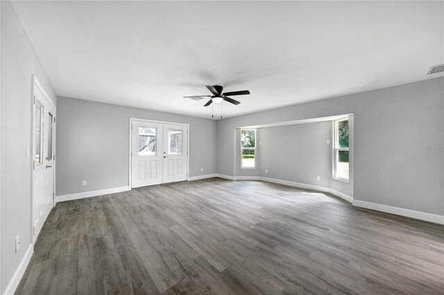 spare room with ceiling fan and wood-type flooring