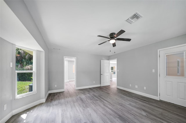 unfurnished living room with ceiling fan and hardwood / wood-style flooring