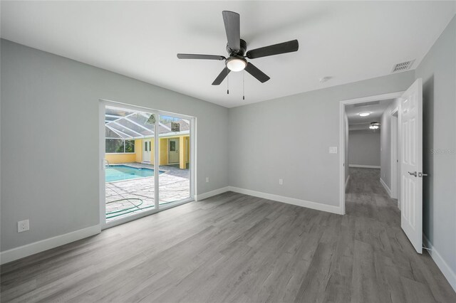 unfurnished room featuring ceiling fan and wood-type flooring