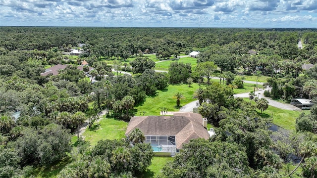 bird's eye view featuring a wooded view