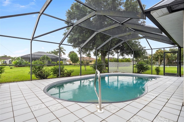 view of swimming pool with a lawn, a patio area, and glass enclosure