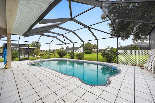 view of pool with a patio area and a yard