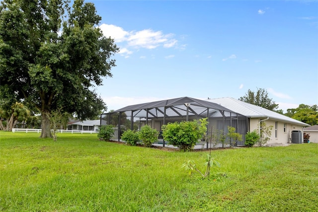 exterior space featuring a lanai and central air condition unit