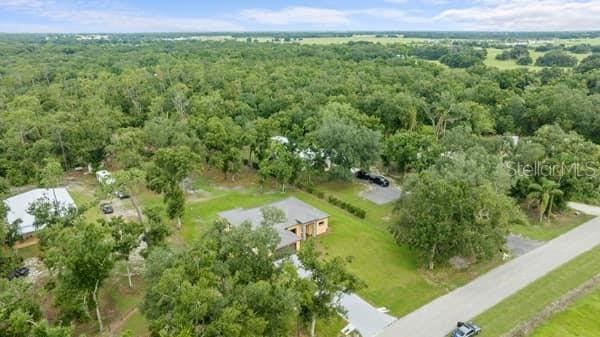 aerial view featuring a wooded view