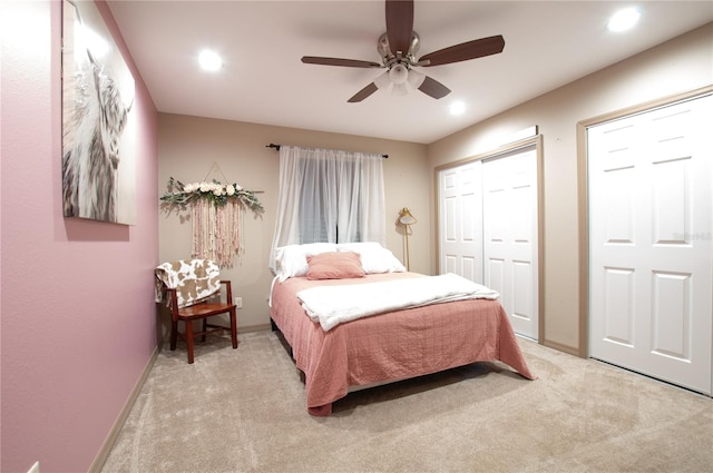 bedroom featuring ceiling fan and light colored carpet