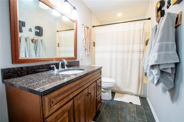 full bathroom with shower / bath combo with shower curtain, vanity, and toilet