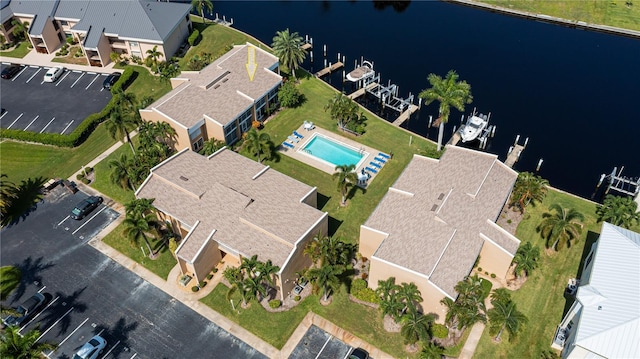 birds eye view of property with a water view