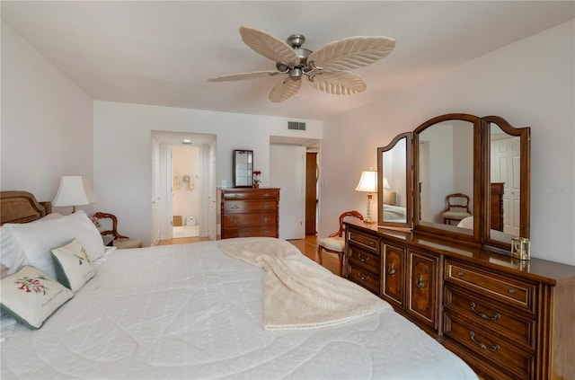 bedroom featuring ceiling fan and ensuite bathroom