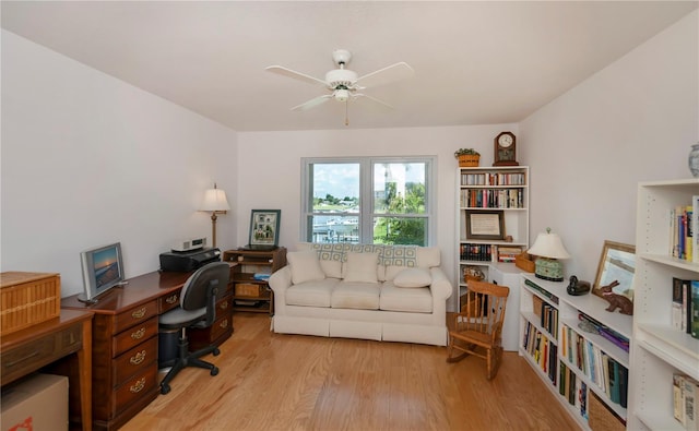 office featuring light wood-type flooring and ceiling fan