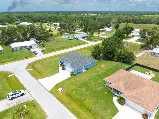 aerial view featuring a residential view and a view of trees