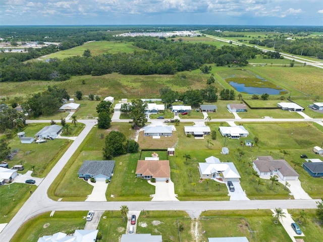 bird's eye view featuring a residential view and a water view