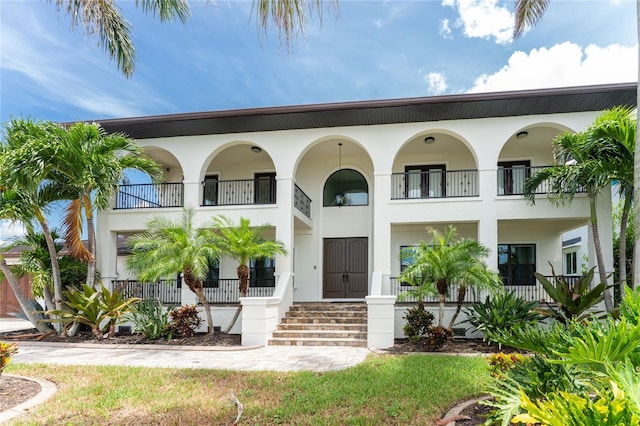 mediterranean / spanish-style house featuring a balcony