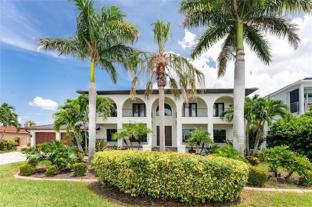 view of front of house with a balcony