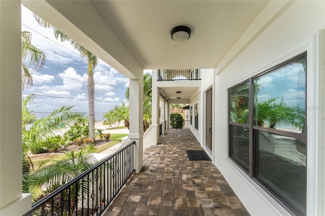 view of patio featuring a balcony