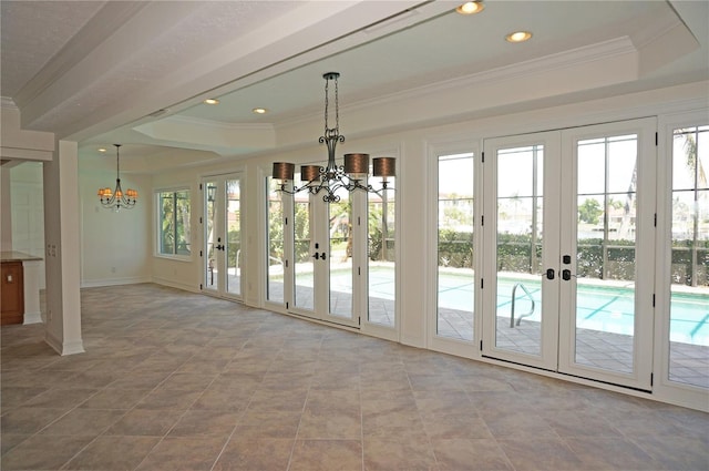 doorway featuring ornamental molding, french doors, and a notable chandelier