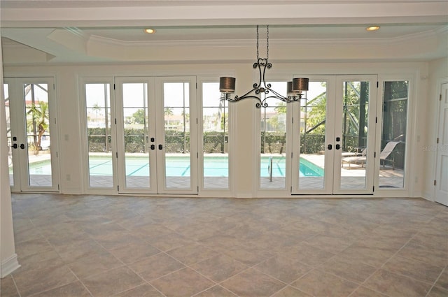 doorway with ornamental molding, french doors, a wealth of natural light, and recessed lighting