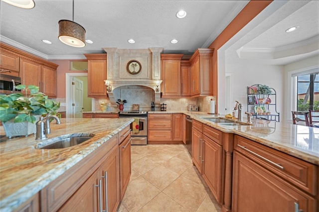 kitchen with appliances with stainless steel finishes, crown molding, a sink, and tasteful backsplash