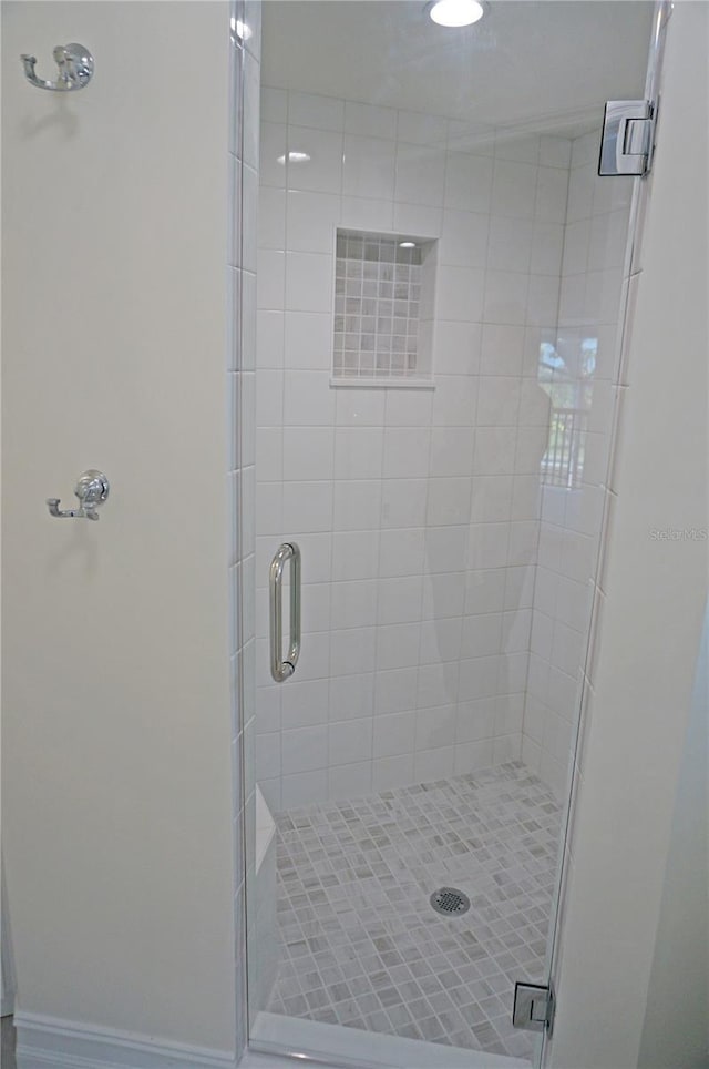 full bathroom with a stall shower