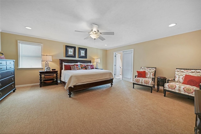 carpeted bedroom featuring baseboards, ornamental molding, ceiling fan, and recessed lighting