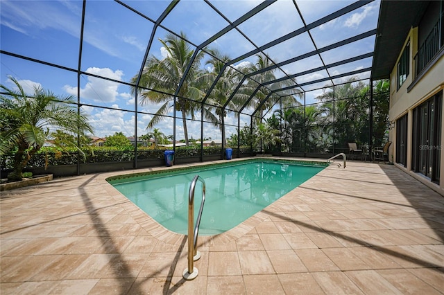 pool featuring a lanai and a patio area