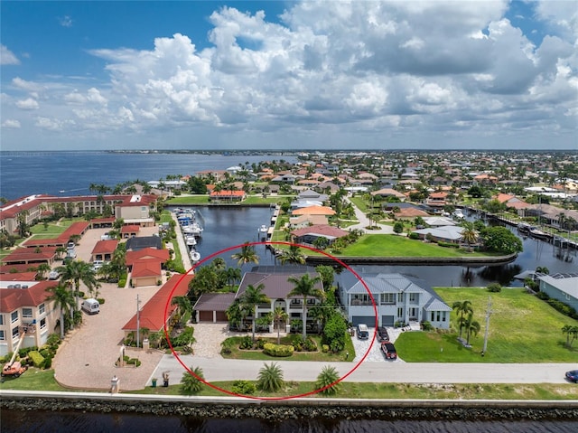 bird's eye view with a residential view and a water view