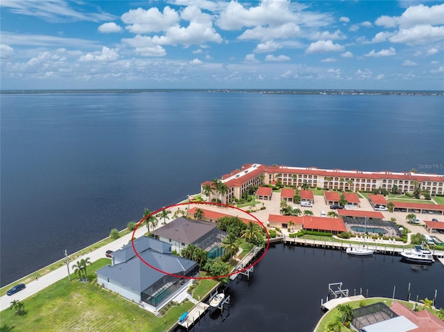 birds eye view of property featuring a water view