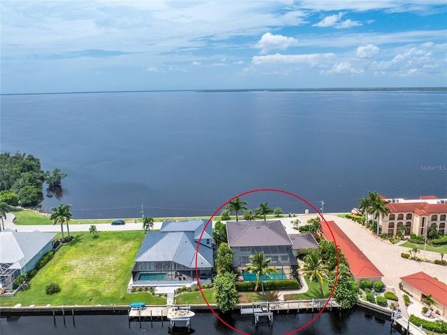 birds eye view of property featuring a water view and a residential view