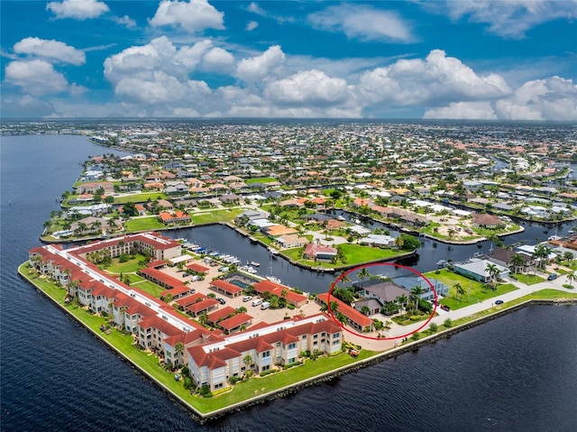 aerial view with a residential view and a water view