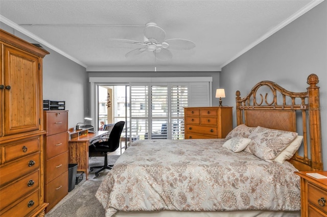 carpeted bedroom with a textured ceiling, ceiling fan, and crown molding