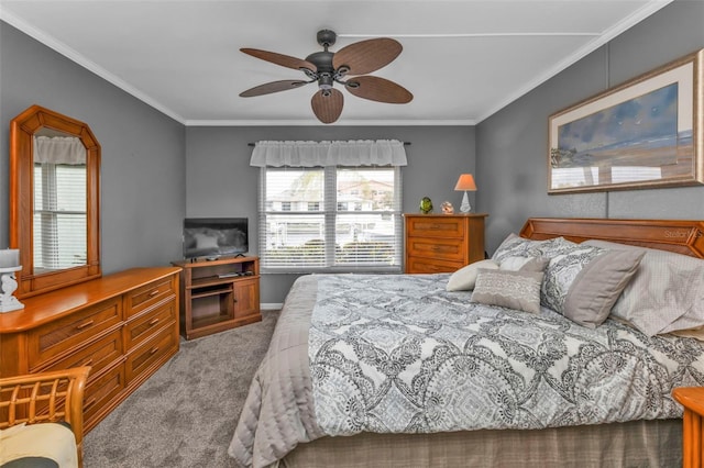 carpeted bedroom with ceiling fan and ornamental molding