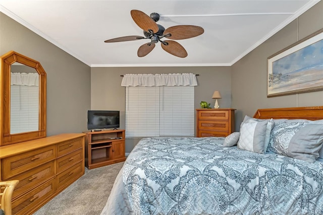 bedroom featuring ceiling fan, crown molding, and light colored carpet