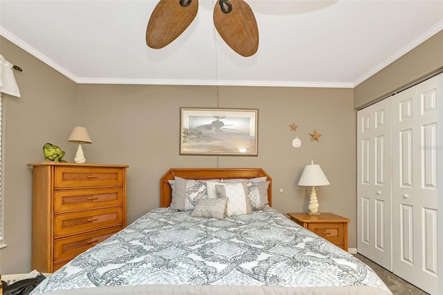 carpeted bedroom featuring a closet, ceiling fan, and crown molding