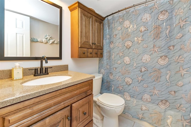 bathroom with vanity and toilet