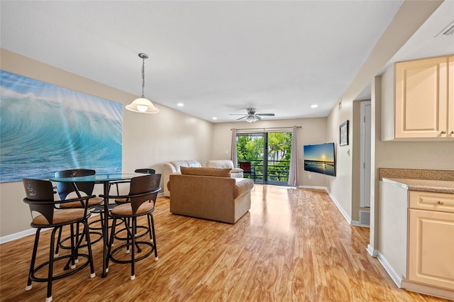 dining area featuring ceiling fan and light hardwood / wood-style floors