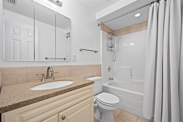 full bathroom with tile patterned floors, shower / bath combo, toilet, tasteful backsplash, and vanity