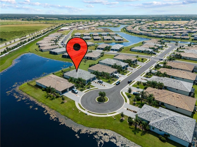 bird's eye view with a water view and a residential view