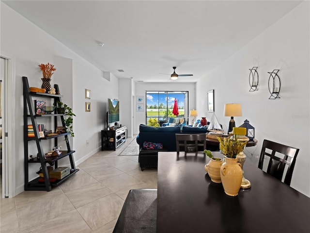 tiled dining area featuring ceiling fan